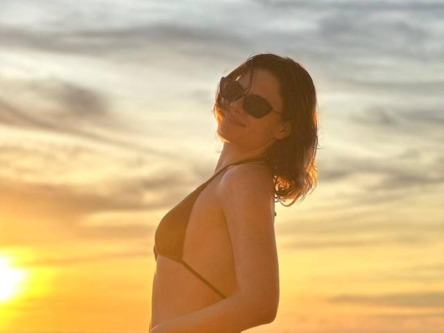 Graphic design of a French flag emblem. Bold, flat colors with white lettering on a blue, white, and red background. Simple, clean lines. SwetHunny not present. Minimalist style.