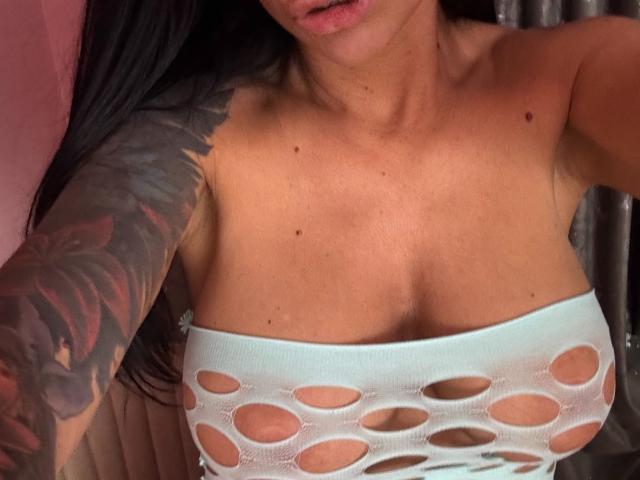 Flat, stylized, red and white, 3D-style coat of arms with a central red square and white cross. Bold, simple colors. AndraD not visible. Symbolic, geometric design.