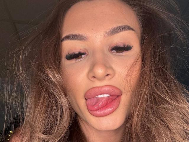 Close-up of a paper fan with a red, semi-transparent center and black, thin, curved lines on the edges. Soft, muted colors. Simple, minimalist design. No visible textures.