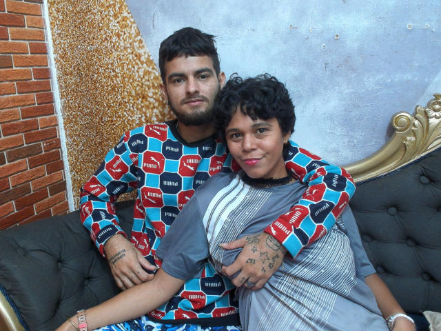 Abstract digital artwork with a large, blurred, rectangular shape in the center. Bright colors, including red, blue, and yellow, are scattered in the background. Minimalistic, geometric style.