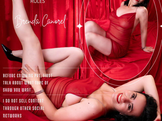 BrendaCantorel in a sheer red dress, laying on her back with legs up, black heels, smiling, showing her tits, red background, mirror reflection, shiny red curtains.