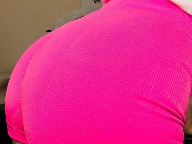 BalletSwan's bright pink ribbed butt, showing tight fabric and smooth skin, centered in the image. The pink color is vibrant and stands out prominently.