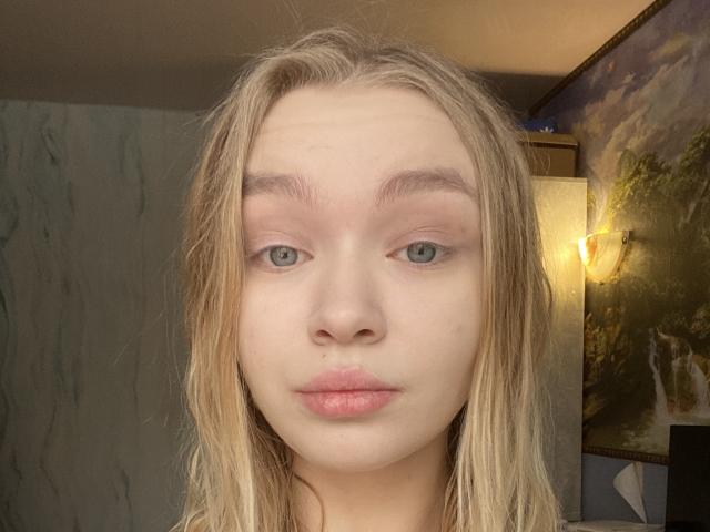 AnnamaeSvehla has wet blonde hair, blue eyes, and pinkish lips with a slight pout. Her eyebrows are thin and she's looking straight at the camera.