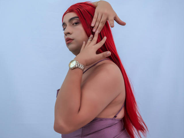 CinthiaFire with red hair, wearing a purple dress, silver watch, and ring, hands up, looking side, showing her tits and ass, against a light blue background.
