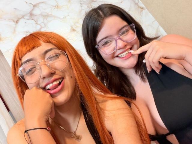 AlexaNDRoss with orange hair and glasses, smiling, has her hand on her cheek, wearing a black top. AlexaNDRoss with brown hair and glasses, smiling, touches her teeth.