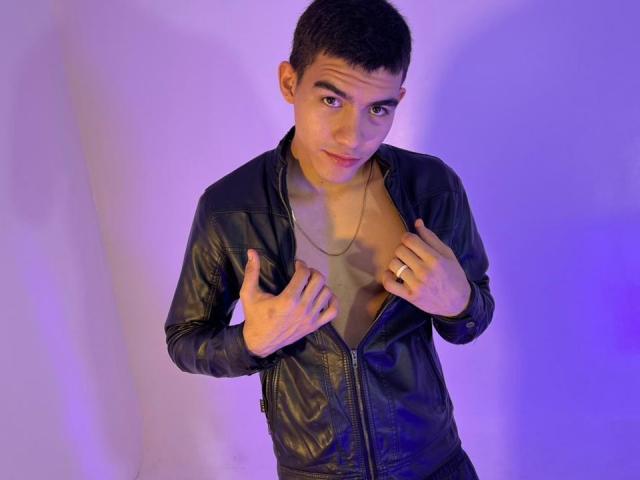 SebastiianVega, short dark hair, black leather jacket, unzipped, exposing chest, looking at camera, hands on jacket, purple-blue light, wearing a ring, slight smirk, attractive.