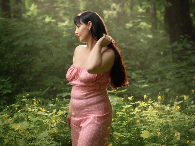 LiluGrants with long black hair, pink polka-dot dress, standing in green forest, gently touching hair, yellow wildflowers, soft sunlight, curvy with visible tits, looking side profile.