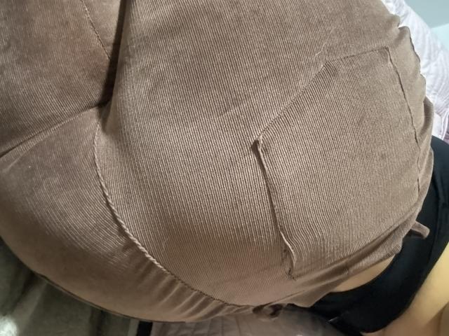 MiaDuboisX's big, brown, ribbed-strap butt in tight, brown, corduroy pants, showing a small, frayed pocket with a visible thread.