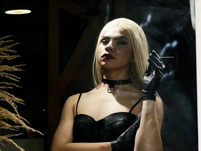 DanySky with platinum blonde hair, black leather choker, strapless black leather top, and black gloves, holding a cigarette, looking seductive, dark lipstick, serious expression.