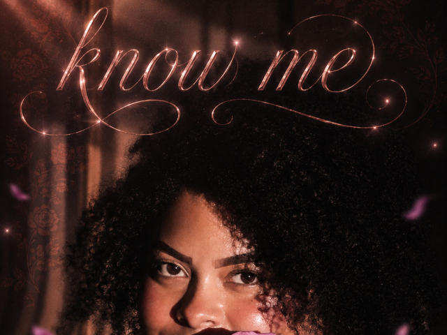 ElizabethBloom has curly black hair and dark skin, with a serious expression. Glowing pink letters spell "know me" above her face. Her eyes are focused and slightly upturned.