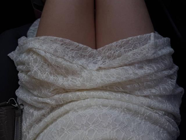 Teffi's ass is covered by a white lace dress, tightly wrapped and showing a bunch of her bare, pale thighs. The lace is textured and slightly translucent.