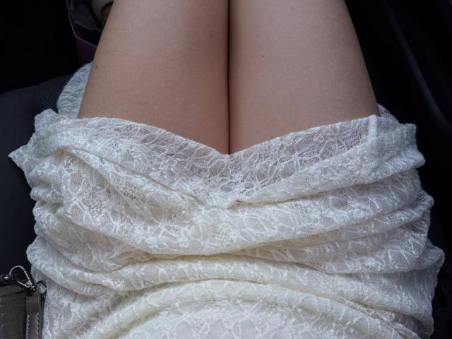 Teffi's white lace dress is pulled down, exposing her bare, pale-skinned, slightly parted, large, soft-ass. The lace texture is visible, and a silver zipper is on the side.