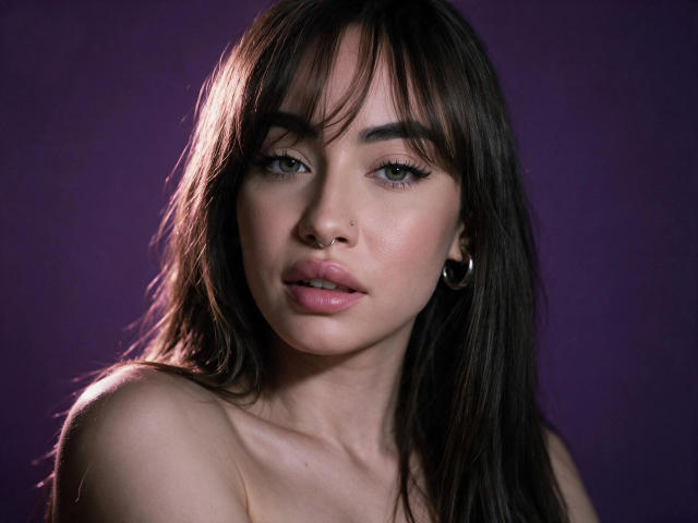 LexiHerzig-hot with brown hair, green eyes, and pink lips, showing off her tits against a purple background, wearing hoop earrings, and looking directly at the camera.