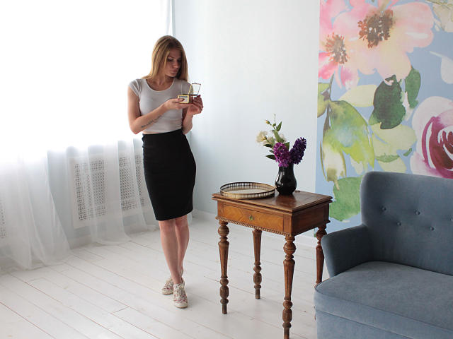 A flat, minimalist design with a large, bold, red and white logo in the center. The logo features a simple, stylized letter "L" in red. Clean, modern style.