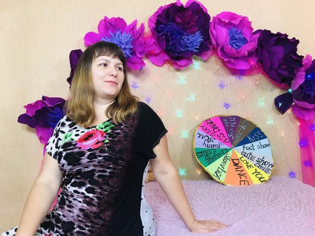 Three colorful, modern art blocks stacked in a vertical arrangement. Each block has a unique, abstract design with bold, geometric patterns in pink, blue, and yellow. Block edges are sharp.