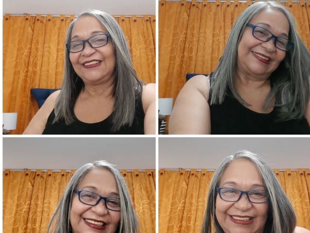 RosarioTriana has gray hair, wears blue glasses, and a black sleeveless top. She's smiling in four different photos, showing varying expressions. Her tits are slightly visible.