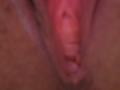 FrenchShanna's pussy, centered in the image, showing her pink, slightly parted labia and visible inner folds, with a soft, blurry texture and warm, pinkish-brown skin tones.