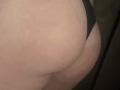 Barbarica's butt in black underwear, showing a pale, slightly bruised, and curved lower backside. The focus is on her ass and the thin strap of the underwear.