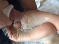HotSexyBigCum's foot is covered in cum, with their dick partially in their mouth. Cum is on their foot and dick, hands are holding their foot.