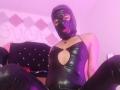 JatziBehot69 in a black latex bodysuit with a cutout over the tits, wearing a black latex mask, sitting with legs spread, on a black bed with pink lighting.