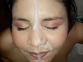 Kappuru's face with cum on her forehead, eyes closed, black eyelashes, pink eyeshadow, and slightly parted lips. She's topless, with visible cheek and nose. Kappuru is Asian.