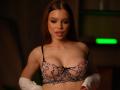 AmalDeyll with brown hair, wearing a pink lace bra with black heart patterns, exposing her tits, white gloves, and a subtle tattoo on her right shoulder.