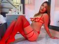 SashaHans, Asian woman with long brown hair, red lingerie with straps, red thigh-highs, sitting on tile floor, looking at camera, showing her tits and ass, smiling.