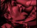 KendallBrzz's face is in a red-tinted shot with her mouth open, tongue out, and a hand gripping her hair, holding a cock near her mouth.