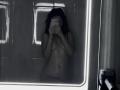 AlexXas, nude with dark wavy hair, holding phone in front of mirror, covering face. Small tits, slim, flat stomach, visible navel, reflection shows bathroom tiles.