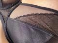 Black mesh lingerie with lace trim, showing a close-up of Barbarica's pussy. The material is sheer, highlighting her skin underneath. Textures are detailed and sensual.