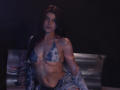 StellaLewin with wet, dark brown hair, wearing a blue tie-dye bikini top, showing her small tits and toned abs, sitting on a shiny silver bench, dark background.