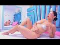 AmaiaCooper, naked, with her tits covered in white paste, sits on a bed, her hand on her pussy, reflected in a mirror, looking surprised. Her ass is visible.