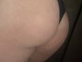 Barbarica's pale, curvy ass in black underwear, showing a faint tan line, with a slight red mark on her right buttock. The focus is on her lower back and butt.