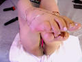 LindaSophieX's bare feet with pink toenails, ankles adorned with a silver anklet, legs spread, revealing her pink pussy. Two black dildo's on a white towel.