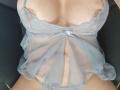 LailaCastillo's sheer blue lace babydoll reveals her tits, with visible tan lines, and a small bow in the center, exposing her pink panties.