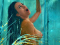 CharlotteKozy with wet black hair, open mouth, arms raised, in a glass shower. Her tits are visible, water drops on her skin, blue-tiled background. Water shoots in front.
