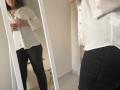 Elliance's reflection shows her in a white button-up shirt and black skirt, with her tits slightly visible under the shirt. Her hand is on her chest, looking down.