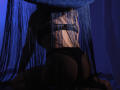 MilenaBaldwin's back is to the camera, wearing black lingerie with thong, under blue bead curtain, showing her ass and back, in dim, blue-lit room.