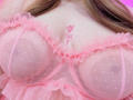 AlayaWillow's big, see-through pink bra with polka dots and frilled edges, showing her tits with small pink flowers tattooed above her cleavage.