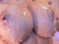 VioletaKim's huge, wet, shiny tits covered in white liquid, with visible nipples and a hand on each side. Her skin is pale and her areolas are slightly raised.