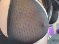 FrenchShanna's black mesh bra with polka dots, showing her nipples through the sheer fabric. Her large tits are visible, and her long black hair is partially in frame.