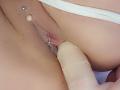 FrenchShanna's pink pussy being penetrated by a beige dildo. She has a silver clitoral piercing and a small bead above it. Her white underwear is partially visible.