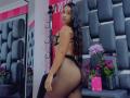 HannaHarper with long black hair, wearing sheer black lingerie, showing her big ass and small tits, standing in front of a mirror, looking back with a slight smile.