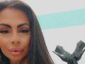 DenyChantal's face with full lips, glossy pink lipstick, dark eyebrows, long eyelashes, and brown hair. She's wearing black high heels in the bottom right.