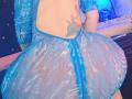 Kkole's huge ass in a blue, see-through mesh dress with a zipper, exposing a back tattoo. Her skin is light, and the dress has a wavy pattern.