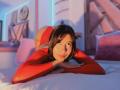 MelisaDaltonn lying on a bed, wearing a red long-sleeve top and red panties, butt up, head down, looking at the camera with a slight smile.