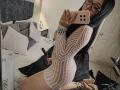 LunaBellaHotty with long black hair, glasses, and a white mesh dress, showing her curvy ass and small tits, taking a mirror selfie in a bedroom.