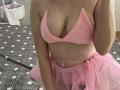 KaiaLein wearing a pink fuzzy bralette and a pink tulle skirt, showing her tits and a sliver of her pussy, with a soft, curvy, fair-skinned body.