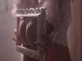 RosaVance holding a white, ornate frame against her large, round ass with lace-covered hands, wearing a sheer pink top, soft light, and subtle shadow.